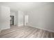 Spacious bedroom featuring wood-look floors and a neutral color palette at 610 E Euclid Ave, Deland, FL 32724