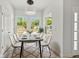 Bright dining area with ample natural light, contemporary furnishings, and decorative rug at 610 E Euclid Ave, Deland, FL 32724