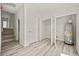 Hallway with stairs, closet, and utility access at 610 E Euclid Ave, Deland, FL 32724