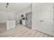 Modern kitchen features hardwood floors, white walls, stainless steel appliances, and lots of cabinet space at 610 E Euclid Ave, Deland, FL 32724