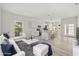 Open-concept living area featuring modern furnishings, stylish decor, and plenty of natural light at 610 E Euclid Ave, Deland, FL 32724