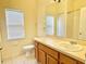 Bathroom featuring a vanity with sink, mirror, and tiled flooring at 671 Carey Way, Orlando, FL 32825