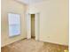 Comfortable bedroom with neutral carpet, closet, and natural light from a window at 671 Carey Way, Orlando, FL 32825