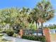 Lake Kehoe Preserve entrance sign amidst lush greenery and palm trees, showcasing the community's natural beauty at 671 Carey Way, Orlando, FL 32825