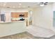 Eat-in kitchen with updated appliances and open layout, seamlessly connecting to the living room, ideal for gatherings at 671 Carey Way, Orlando, FL 32825