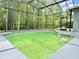 The screened-in pool offers a private retreat surrounded by lush greenery and a relaxing atmosphere at 671 Carey Way, Orlando, FL 32825