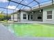 Screened-in pool area for entertainment and relaxing with outdoor ceiling fans and ample patio space at 671 Carey Way, Orlando, FL 32825