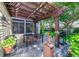 Backyard patio area with a pergola, a dining table, and a grill for outdoor entertaining at 714 Regina Cir, Oakland, FL 34787