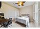 This spare bedroom has neutral walls, carpet, and a ceiling fan at 714 Regina Cir, Oakland, FL 34787