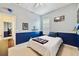 This bedroom features neutral walls, blue wainscoting, and a ceiling fan at 714 Regina Cir, Oakland, FL 34787
