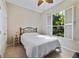 This bedroom features a comfortable bed, a window view, and natural light at 714 Regina Cir, Oakland, FL 34787