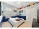 This bedroom features neutral walls, blue wainscoting, a ceiling fan and two large closets at 714 Regina Cir, Oakland, FL 34787