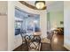 Breakfast nook with glass table and wrought iron chairs, overlooking the patio at 714 Regina Cir, Oakland, FL 34787