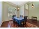 Bright dining room with large window, chandelier, and ample space for gatherings at 714 Regina Cir, Oakland, FL 34787