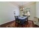 Elegant dining room features a chandelier, large window, and stylish rug, ideal for entertaining at 714 Regina Cir, Oakland, FL 34787