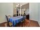 Formal dining room featuring dark wood floors and a chandelier at 714 Regina Cir, Oakland, FL 34787