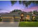 Charming home featuring a three-car garage, manicured lawn, and beautiful landscaping with inviting front door at 714 Regina Cir, Oakland, FL 34787