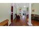 Inviting living room with beautiful hardwood floors, a ceiling fan, and an open floor plan at 714 Regina Cir, Oakland, FL 34787