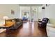 Open-concept living room and dining room with hardwood floors at 714 Regina Cir, Oakland, FL 34787