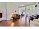 Bright living room with hardwood floors and views into dining room at 714 Regina Cir, Oakland, FL 34787