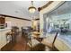 Open floor plan with breakfast nook, bar seating, and living room, perfect for entertaining at 714 Regina Cir, Oakland, FL 34787