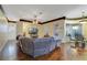 Open concept living space with hardwood floors, living room, nook, and access to the patio at 714 Regina Cir, Oakland, FL 34787