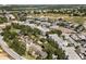 An aerial view showcases a community with golf courses, pools and lush landscaping at 7505 Mourning Dove Cir # 201, Reunion, FL 34747