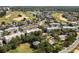 An aerial view of a golf course community showcasing lush greenery and residential buildings at 7505 Mourning Dove Cir # 201, Reunion, FL 34747