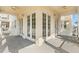 A bright balcony features French doors and ceiling fans for a relaxing outdoor space at 7505 Mourning Dove Cir # 201, Reunion, FL 34747