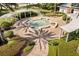 A serene fountain with lush landscaping provides a peaceful community gathering space at 7505 Mourning Dove Cir # 201, Reunion, FL 34747