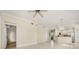 Open living area featuring tile floors that seamlessly connect to a modern kitchen with stainless steel appliances at 7505 Mourning Dove Cir # 201, Reunion, FL 34747