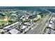 Overhead shot of a golf community, showing the residential area, golf course, and surrounding businesses at 7509 Mourning Dove Cir # 201, Reunion, FL 34747
