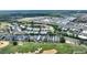 Aerial image of a residential area with well-maintained homes near a golf course, highlighting the community's layout at 7509 Mourning Dove Cir # 201, Reunion, FL 34747