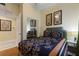 Comfortable bedroom features a queen size bed and closet with mirrored doors at 7509 Mourning Dove Cir # 201, Reunion, FL 34747