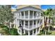 Stunning three-story condo building featuring elegant balconies and classic architectural details at 7509 Mourning Dove Cir # 201, Reunion, FL 34747