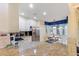 Contemporary kitchen featuring granite counters, stainless appliances, and a cozy breakfast nook at 7509 Mourning Dove Cir # 201, Reunion, FL 34747