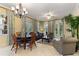 Bright living room with tile flooring, stylish decor, and expansive windows for natural light at 7509 Mourning Dove Cir # 201, Reunion, FL 34747
