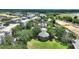 Community pool with gazebo and lush landscaping, providing a relaxing oasis at 7509 Mourning Dove Cir # 201, Reunion, FL 34747