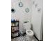 Simple bathroom featuring charming mirrors and a functional toilet at 8704 Tom Costine Rd, Lakeland, FL 33809