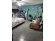 Cozy bedroom with a calming aqua wall and tile floors at 8704 Tom Costine Rd, Lakeland, FL 33809