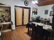 Traditional dining room featuring wood floors, built-in shelving and a desk area for a flexible workspace at 8704 Tom Costine Rd, Lakeland, FL 33809