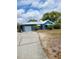 Inviting single-story home with a convenient garage and neatly kept lawn at 8704 Tom Costine Rd, Lakeland, FL 33809