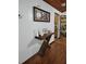 Welcoming hallway showcasing a wooden console table with decor and hardwood flooring at 8704 Tom Costine Rd, Lakeland, FL 33809