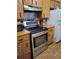 Functional kitchen with stainless steel appliances and ample cabinet space at 8704 Tom Costine Rd, Lakeland, FL 33809