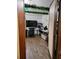 A home office features wood floors, white walls, and a computer desk at 8704 Tom Costine Rd, Lakeland, FL 33809