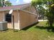Exterior side view of the house with a well-manicured lawn at 8750 Se 88Th Ave, Ocala, FL 34472