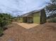 The backyard features a patio, solar panels on the roof, and a lawn at 101 Grand Junction Blvd, Orlando, FL 32835