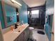 Modern bathroom with a glass-enclosed shower, a sink, and a marble floor at 101 Grand Junction Blvd, Orlando, FL 32835