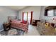 Cozy bedroom with a vaulted ceiling, natural light, and warm decor at 101 Grand Junction Blvd, Orlando, FL 32835
