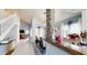Open-concept dining area with high ceilings, stylish decor, and a charming staircase at 101 Grand Junction Blvd, Orlando, FL 32835